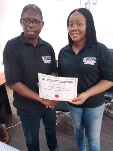 Presentation of certificate to Mrs Jane Okorie - Asst Gov of the Jan to Feb session